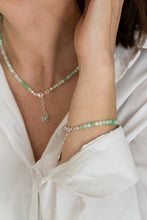 Load image into Gallery viewer, Person wearing a green beaded necklace and bracelet on a white background